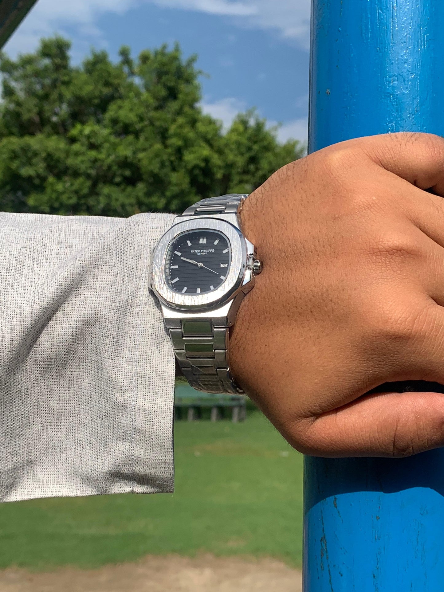 Luxury in Contrast: Patek Philippe Silver Chain, Black Dial
