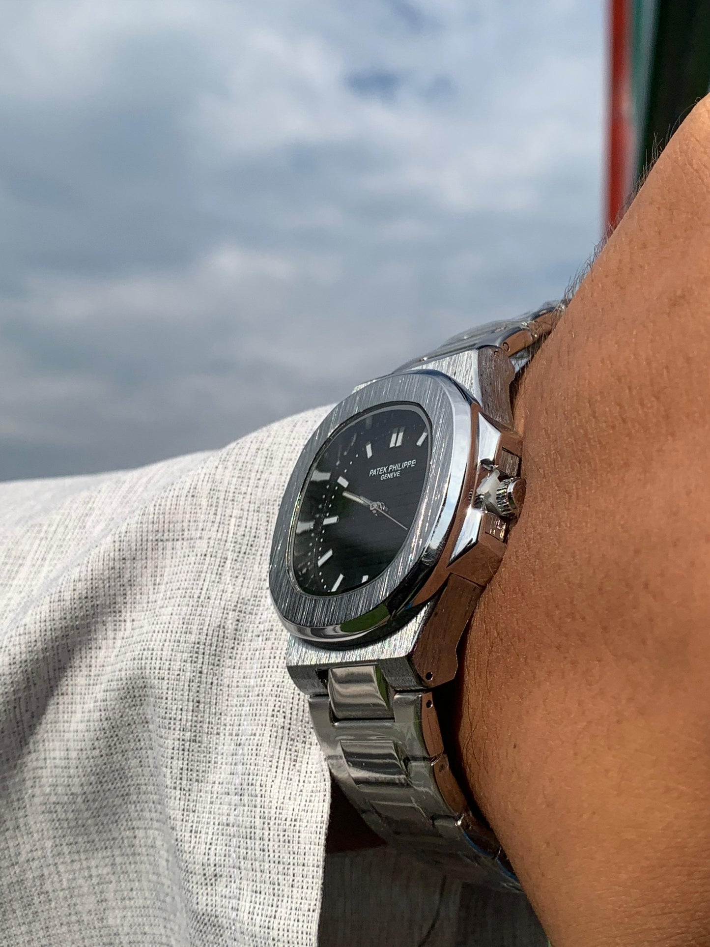 Luxury in Contrast: Patek Philippe Silver Chain, Black Dial
